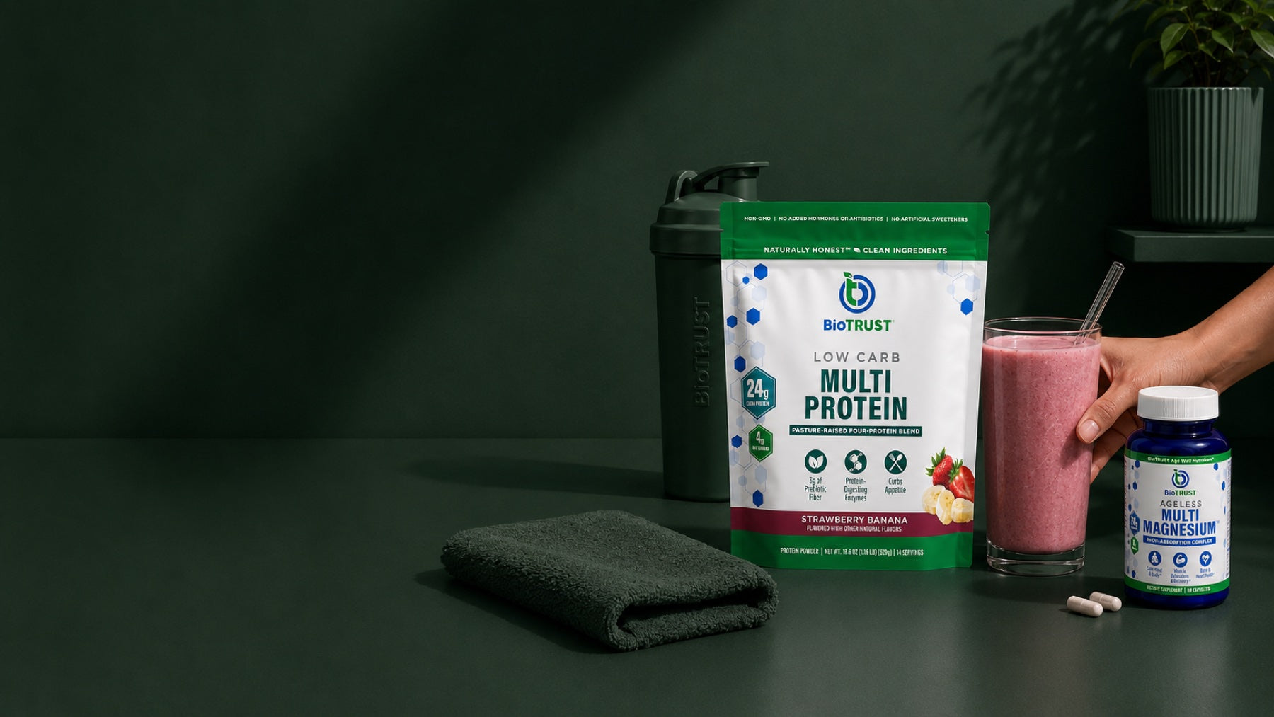 BioTRUST Low Carb Multi Protein and Ageless Multi Magnesium on a dark green counter