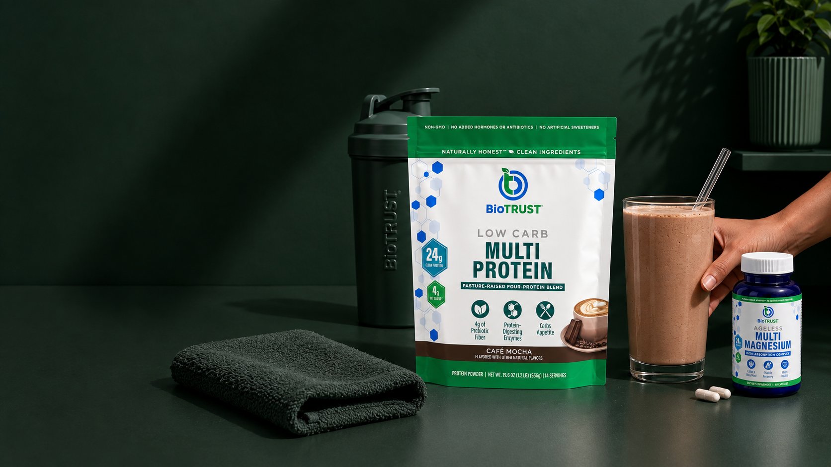 BioTRUST Low Carb Multi Protein and Ageless Multi Magnesium on a dark green counter