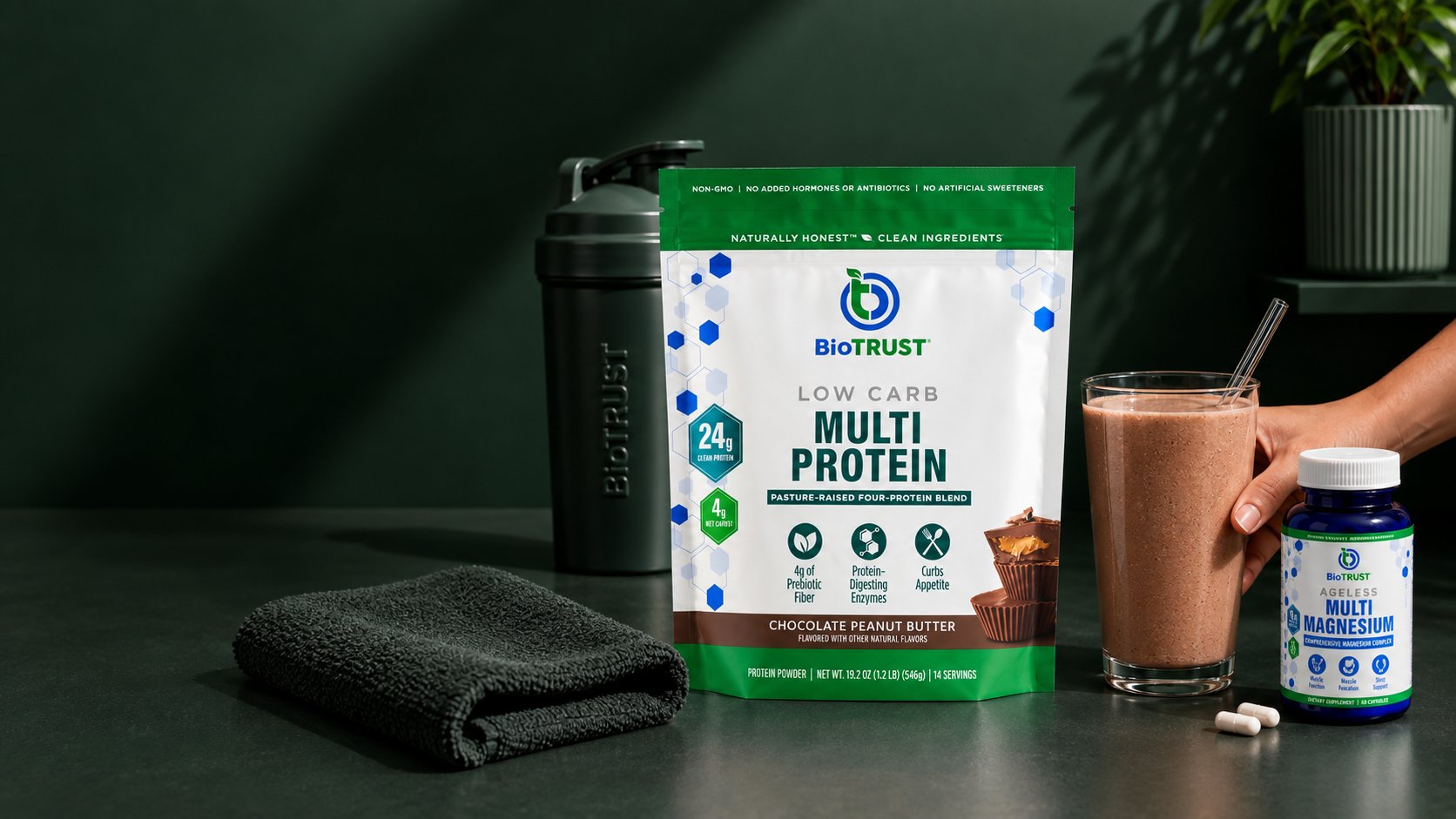 BioTRUST Low Carb Multi Protein and Ageless Multi Magnesium on a dark green counter